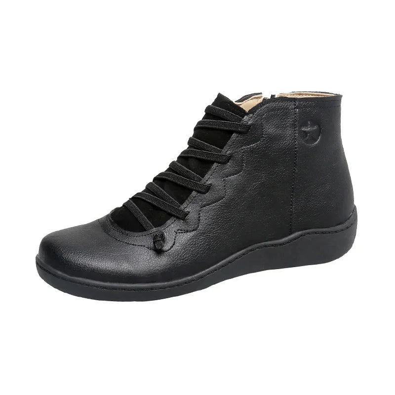 Black women’s leather ankle boot with lace-up front and round toe on white background