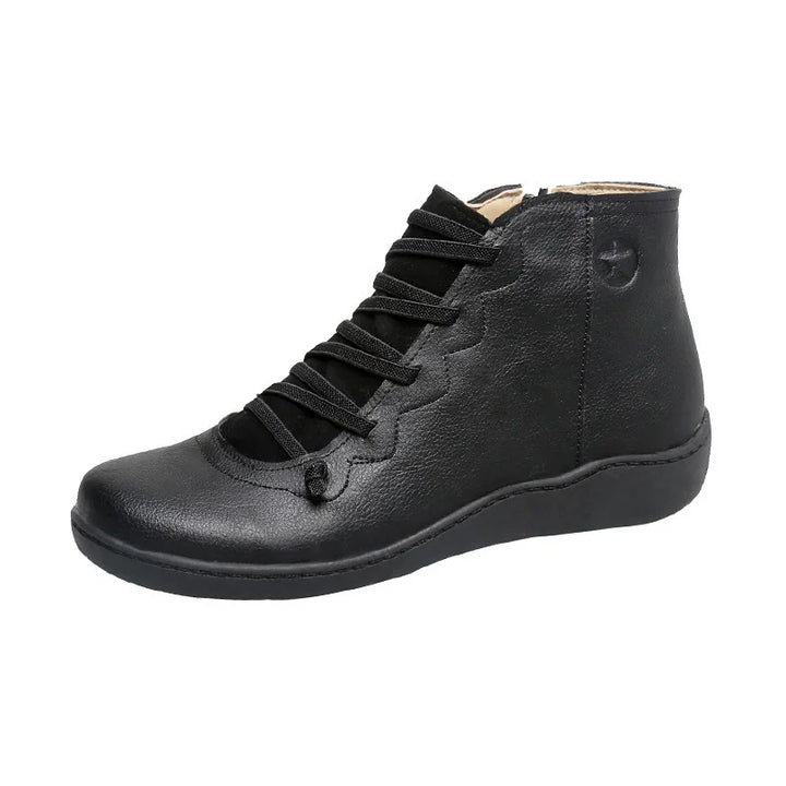 Black women’s leather ankle boot with lace-up front and round toe on white background