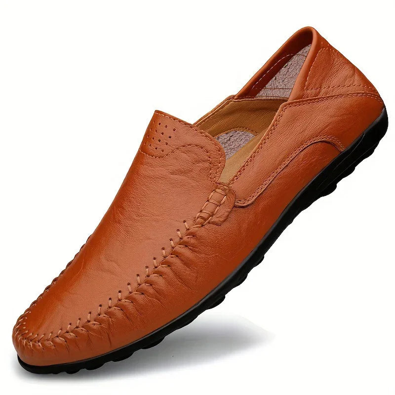Men's brown leather moccasin loafer with black rubber sole and hand-stitched detailing