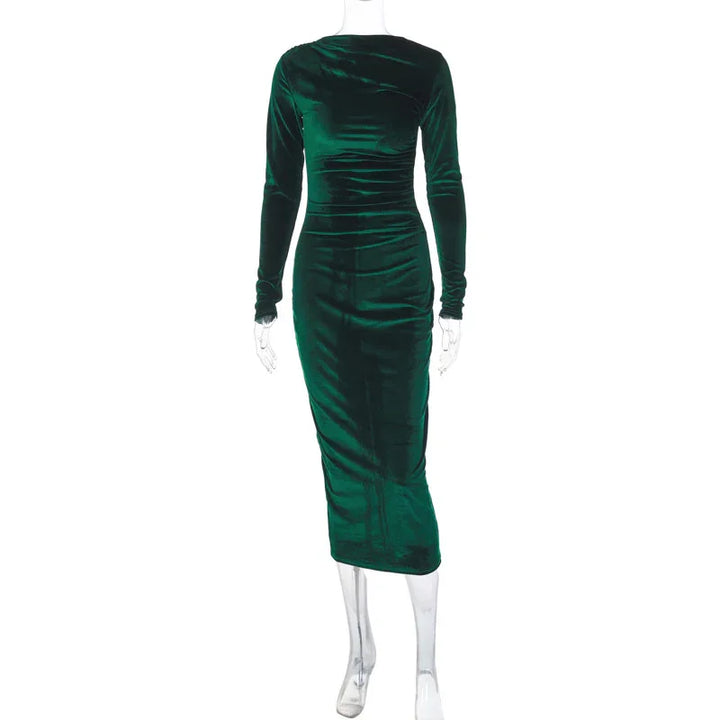 Emerald green velvet long sleeve midi dress on clear mannequin against white background
