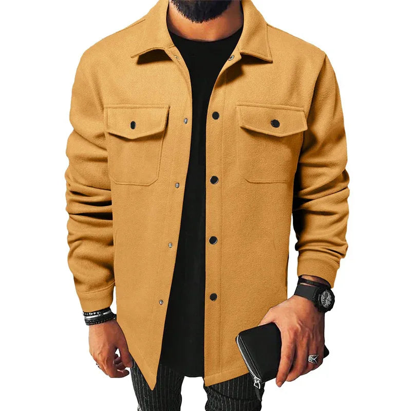 man wearing camel brown button-up jacket with chest pockets holding black wallet