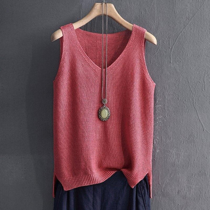 Sleeveless knitted dusty rose tank top with V-neck, paired with pendant necklace on wooden hanger