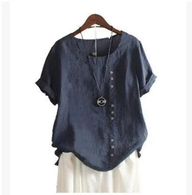 Navy blue short-sleeve linen blouse with asymmetric button design, paired with white pants