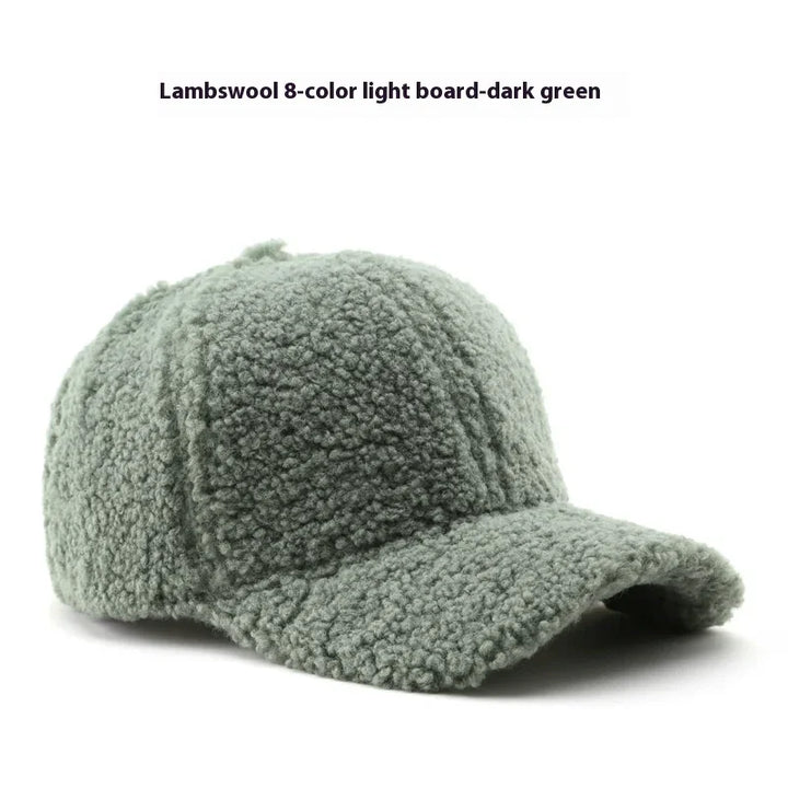 Dark green lambswool baseball cap with soft textured fabric and curved brim