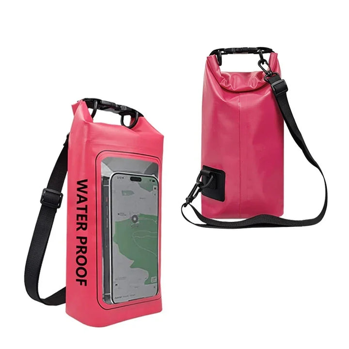 Pink waterproof dry bag with phone holder and black shoulder strap on white background