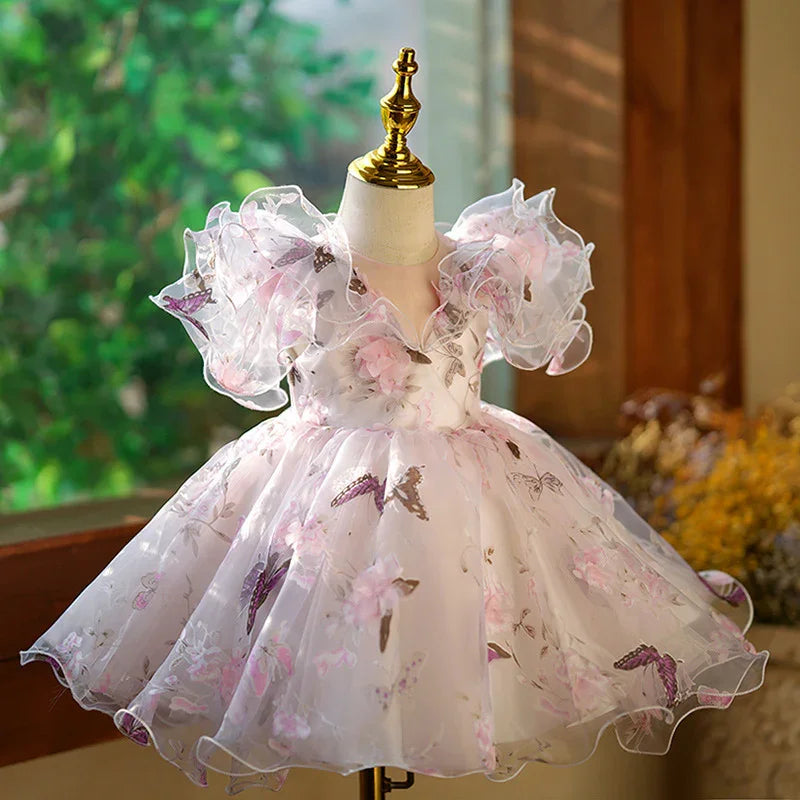 Elegant baby girls' pink floral butterfly party dress with puffy sleeves on mannequin