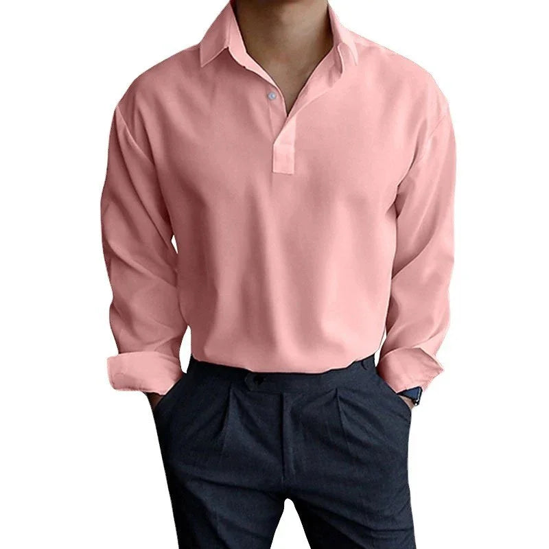 Man wearing a pink long-sleeve polo shirt with black pants, casual smart outfit