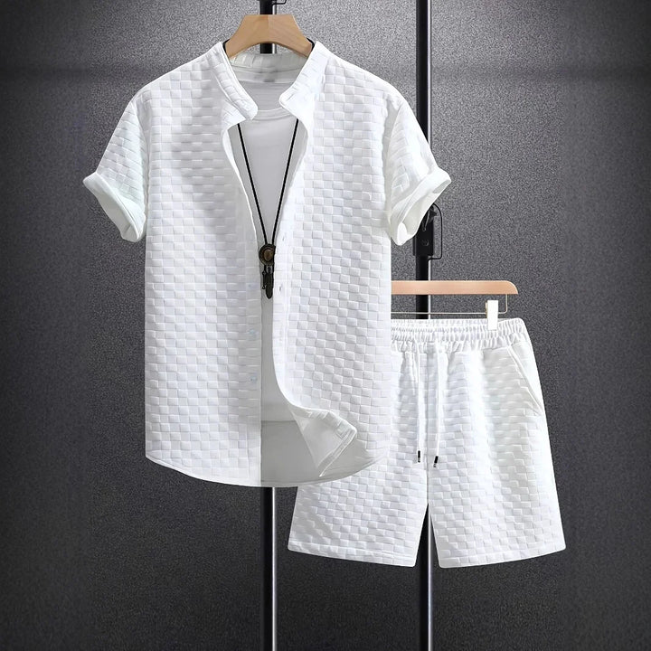 White textured short-sleeve shirt and matching shorts set on hangers with necklace accessory