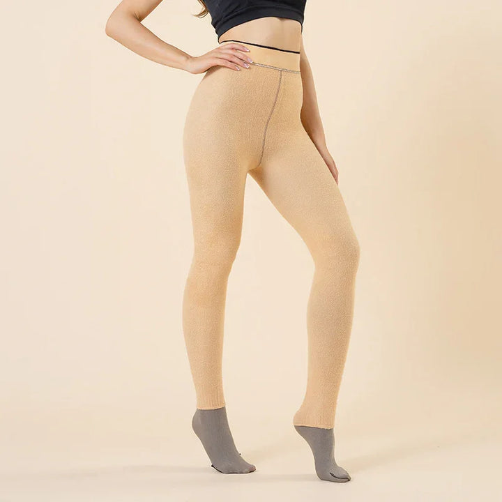 Woman wearing beige textured leggings with gray toe socks against a beige background