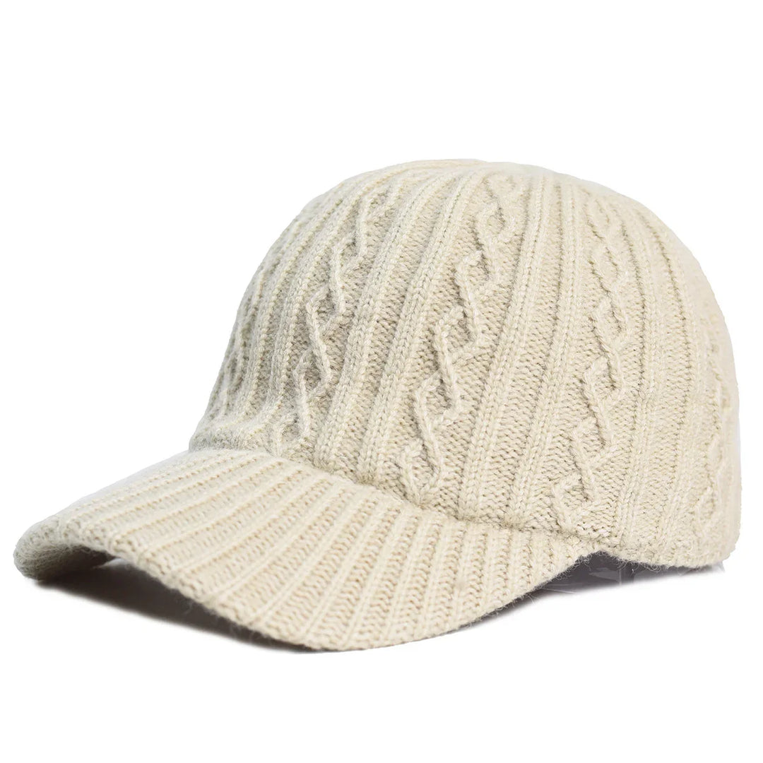Beige cable knit wool baseball cap with textured pattern and curved brim