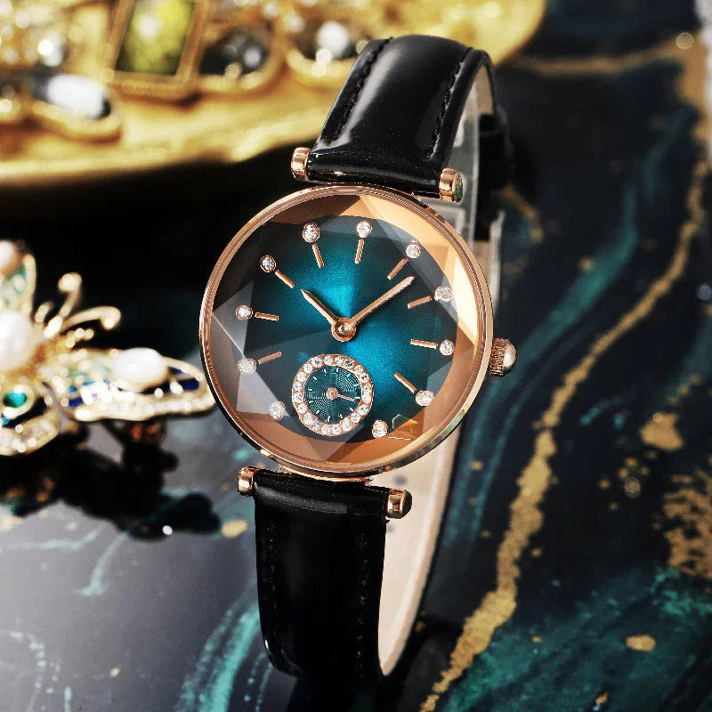Luxury wristwatch with teal dial, rose gold case, diamond hour markers, and black leather strap