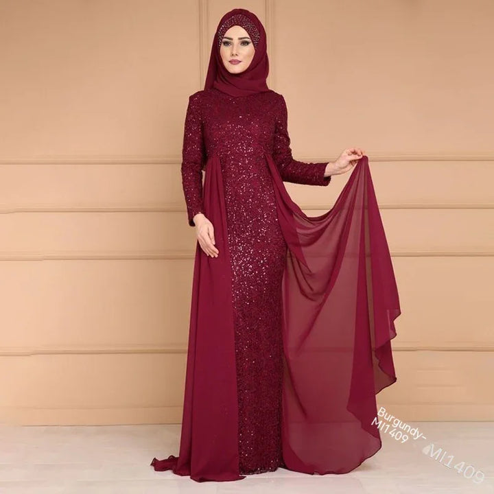 Model wearing a burgundy sequin evening gown with matching hijab and flowing chiffon detail