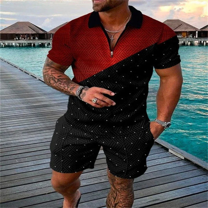 Man wearing red and black short-sleeve polo shirt and matching shorts standing on wooden pier over turquoise water