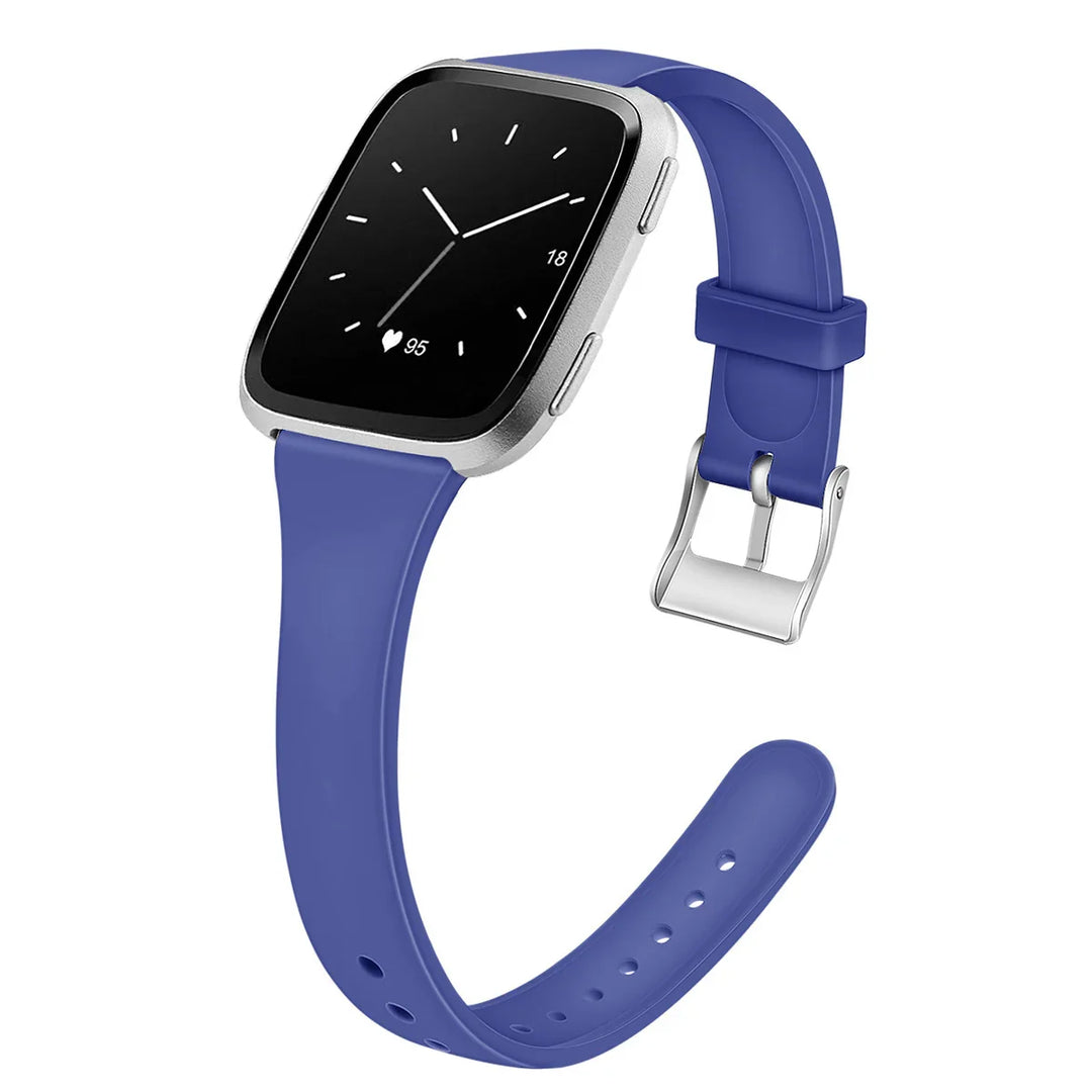 Modern smartwatch with blue silicone band and silver case showing analog clock and heart rate 95