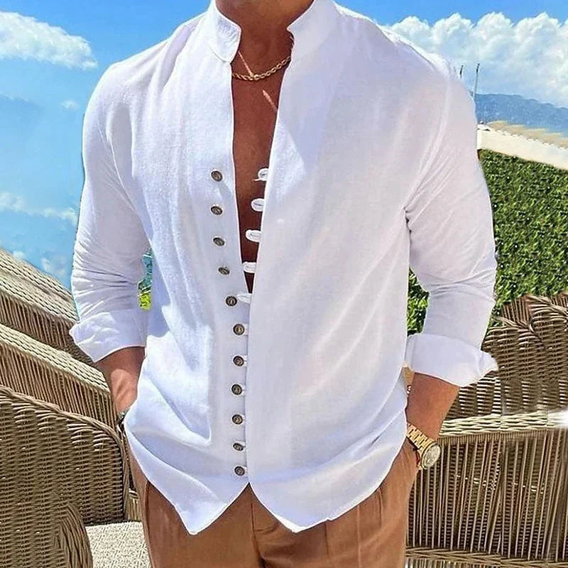 Man wearing a white button-down shirt with a unique placket design and beige pants outdoors