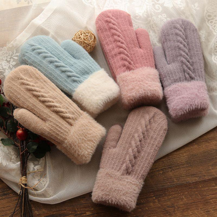 Soft knit winter mittens in pastel colors with fluffy cuffs and cable knit pattern