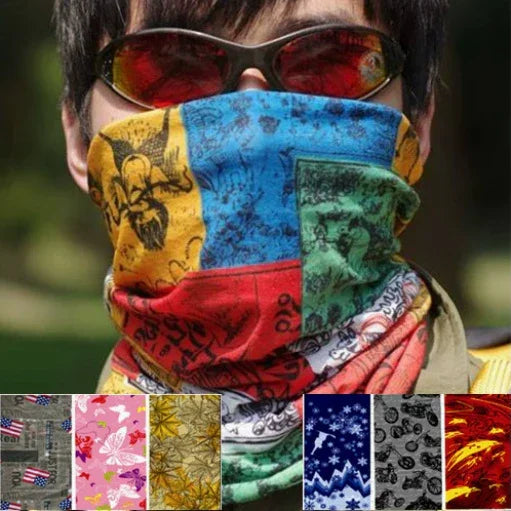 Person wearing colorful patchwork face scarf with sunglasses outdoors in daylight