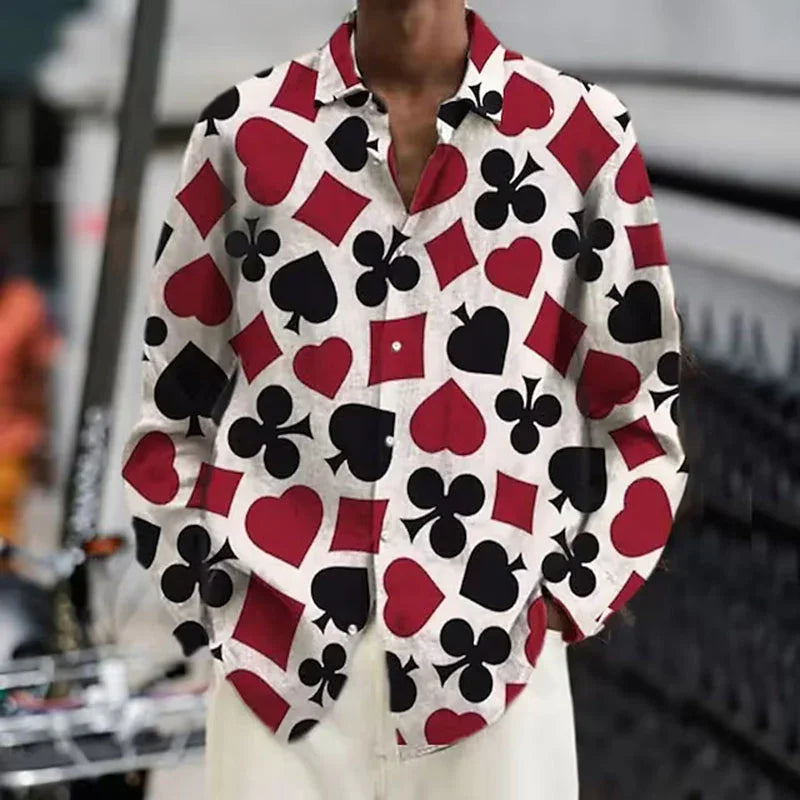 White shirt with red and black playing card suits print, styled with white pants