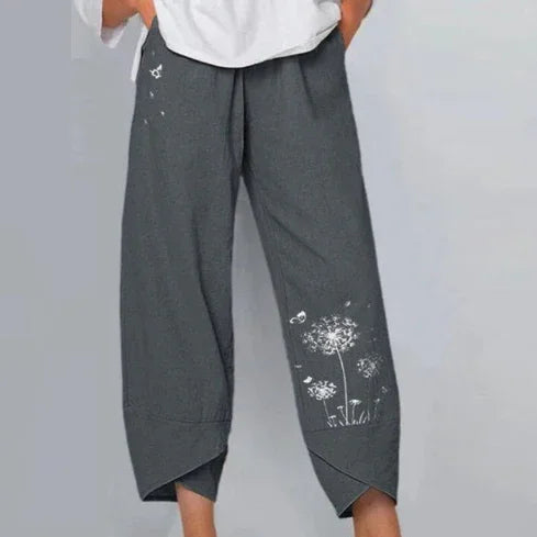 Casual loose-fit dark gray cropped pants with white dandelion flower print and crossed cuffs