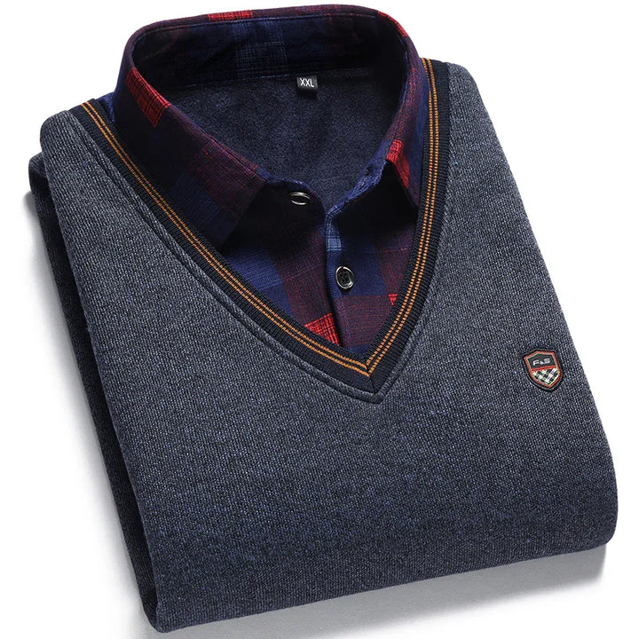Folded men's V-neck grey sweater layered over dark blue and red plaid shirt with XXL tag and small emblem