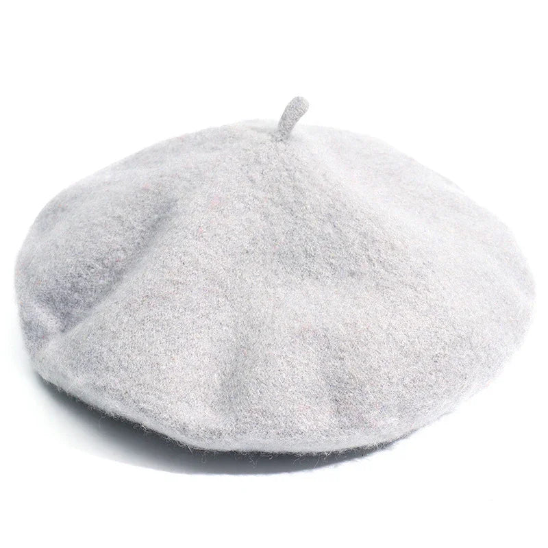 Light gray wool beret hat with classic rounded shape and small top stem on white background