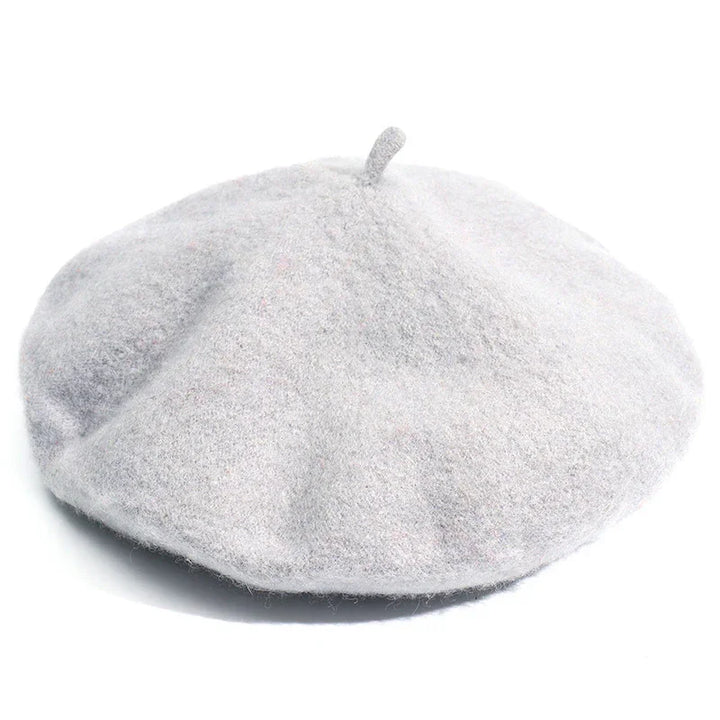 Light gray wool beret hat with classic rounded shape and small top stem on white background