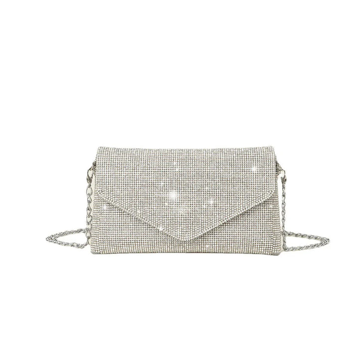Silver rhinestone envelope clutch bag with chain strap glittering on white background
