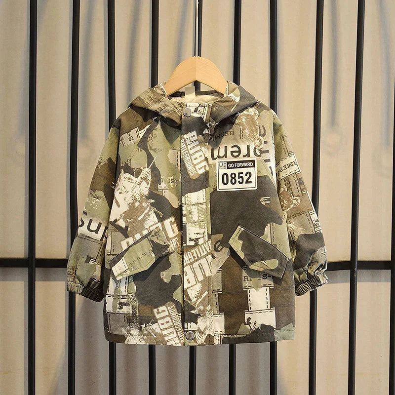 Children's hooded jacket with green and brown camouflage print and front pockets on hanger