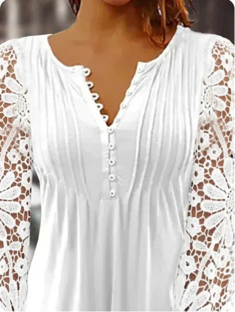 White long-sleeve blouse with lace floral sleeves and button-down front detail