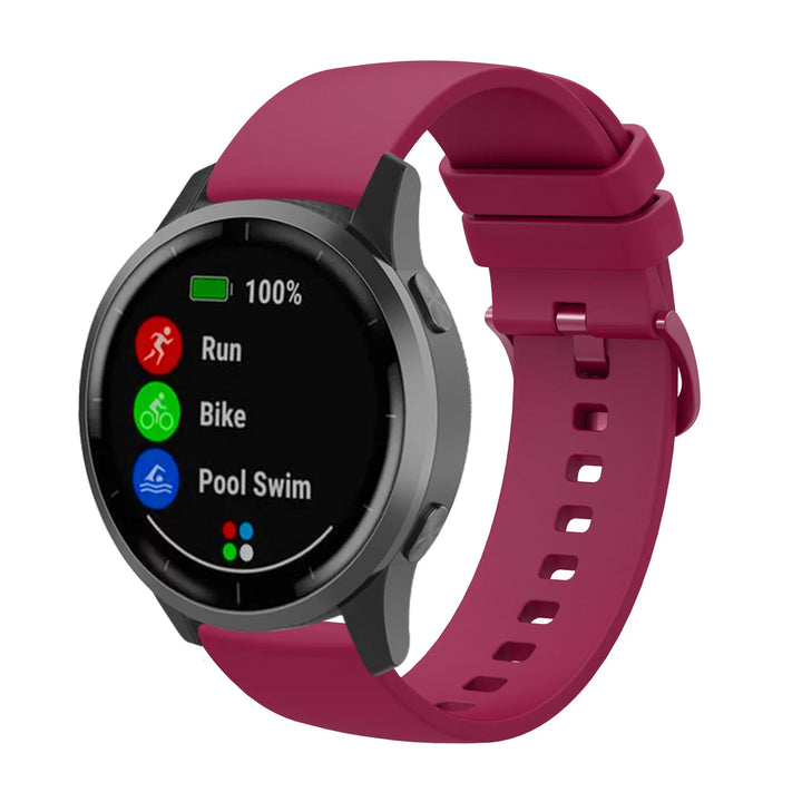 Smartwatch with maroon silicone band displaying 100% battery and workout options for run, bike, and pool swim