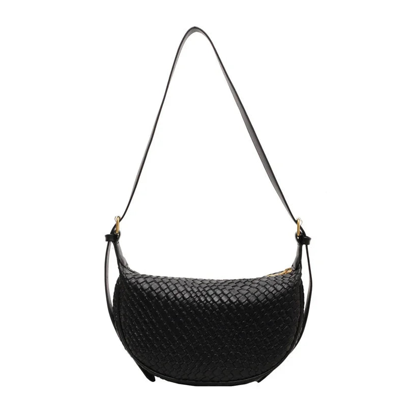 Black woven leather shoulder bag with gold zipper and adjustable strap on white background