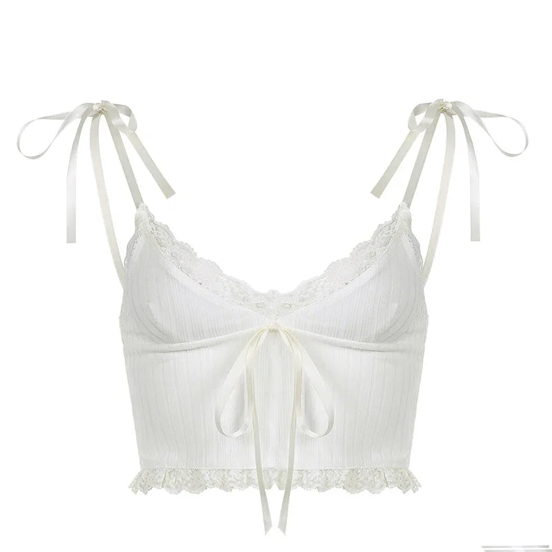 White lace-trimmed cropped camisole with ribbon ties on shoulders and front bow detail