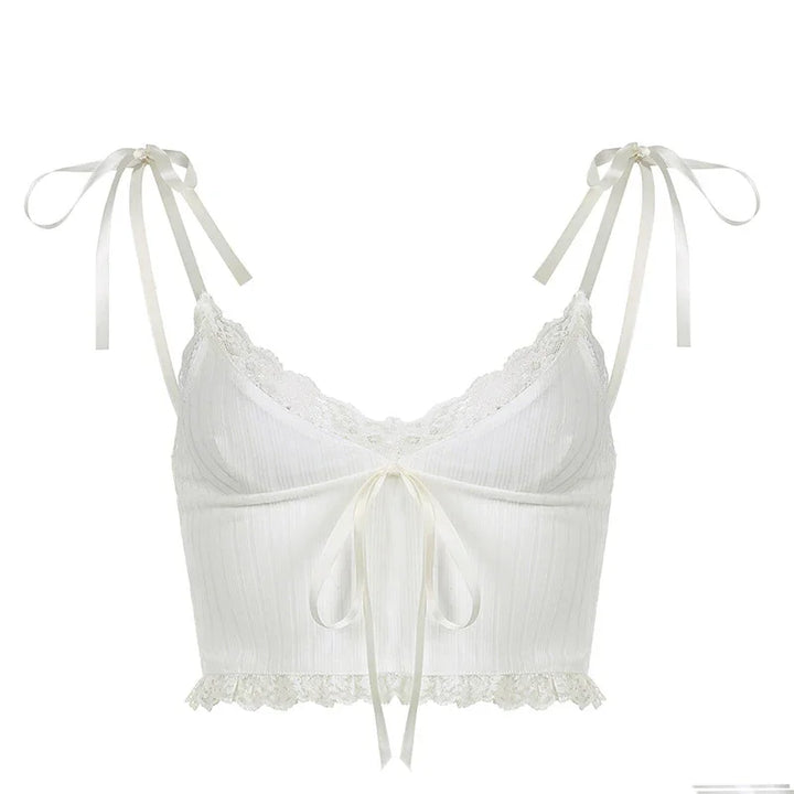 White lace-trimmed cropped camisole with ribbon ties on shoulders and front bow detail