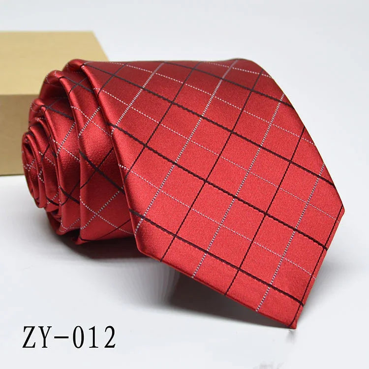 Red men's silk necktie with black and silver checkered pattern, rolled with beige box