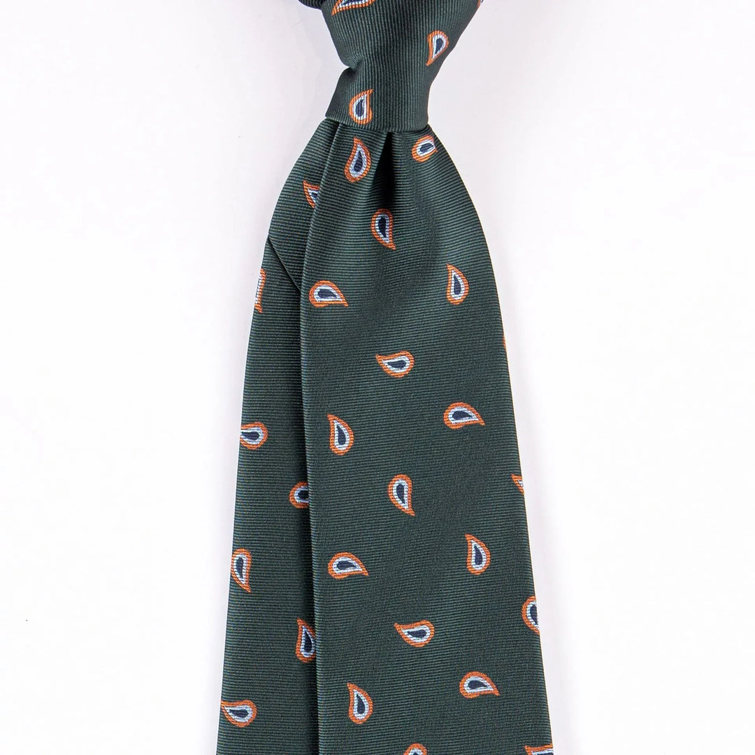 Dark green silk necktie with orange and white paisley pattern on white background