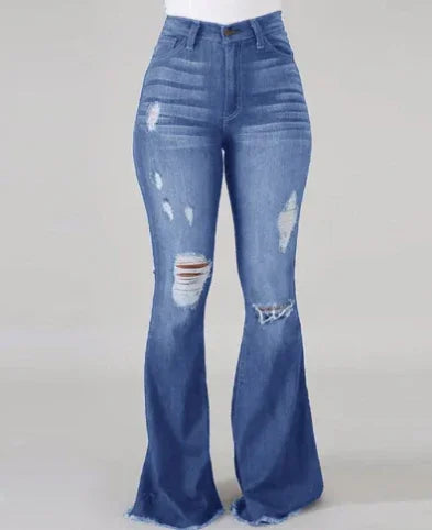High-waisted blue distressed flare jeans with ripped and frayed details on neutral background
