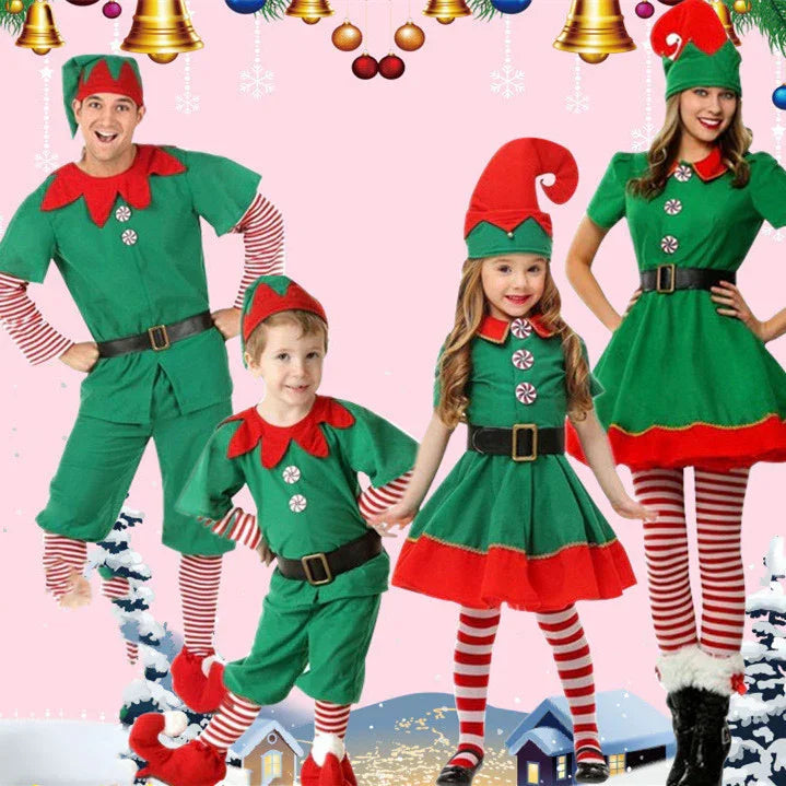 Family dressed in festive green and red Christmas elf costumes with striped tights against a snowy holiday backdrop