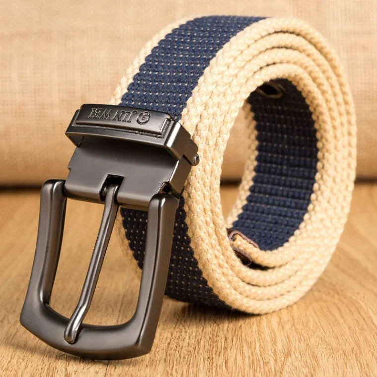 Beige and navy woven fabric belt with black metal buckle on wooden surface
