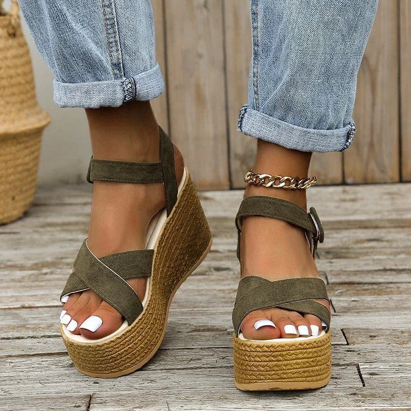 women's khaki suede platform wedge sandals with ankle strap and gold chain anklet on wooden deck