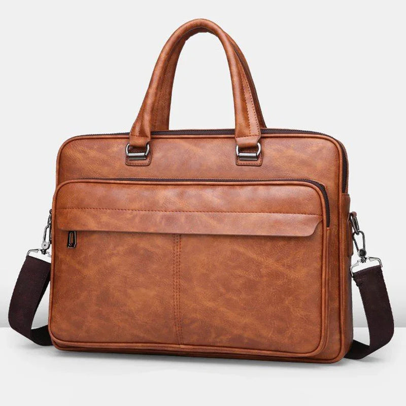 Brown leather briefcase with double handles, front zippered pocket, and detachable shoulder strap