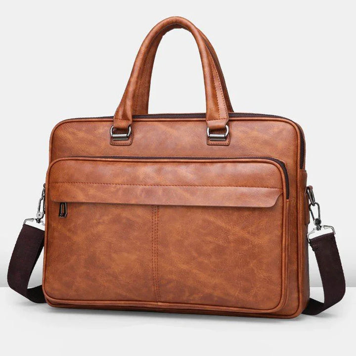 Brown leather briefcase with double handles, front zippered pocket, and detachable shoulder strap