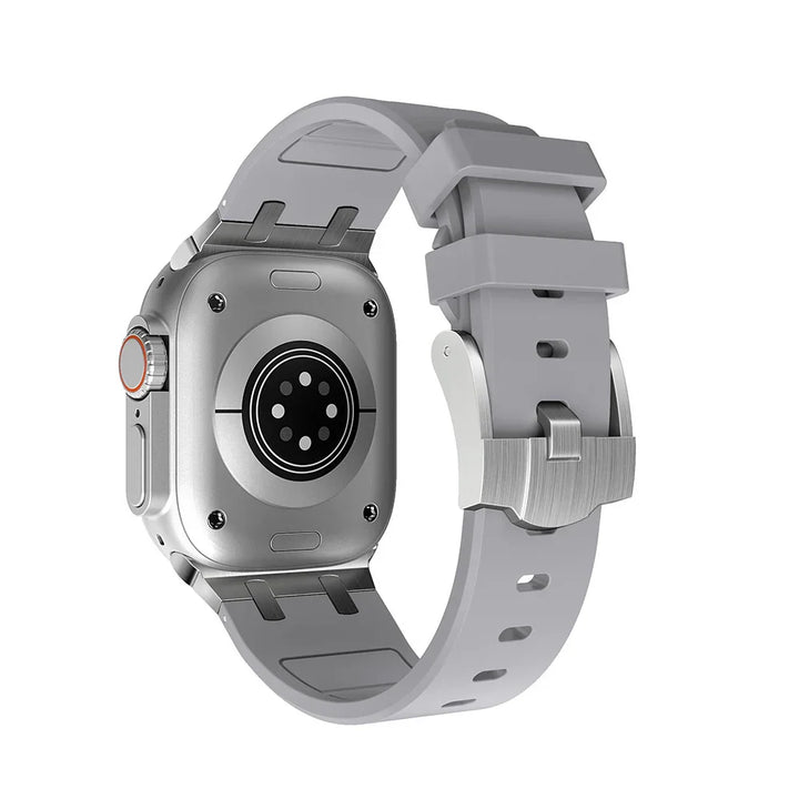 back view of silver smartwatch with gray silicone strap and metal clasp on white background