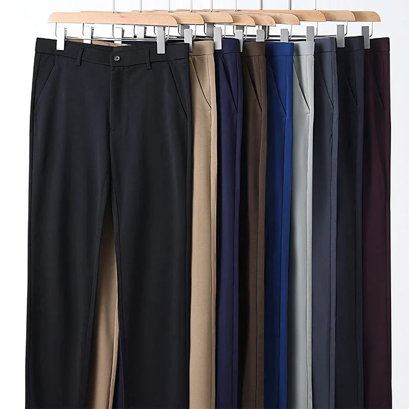 Nine pairs of formal trousers in black, beige, navy, brown, blue, gray, and maroon on wooden hangers