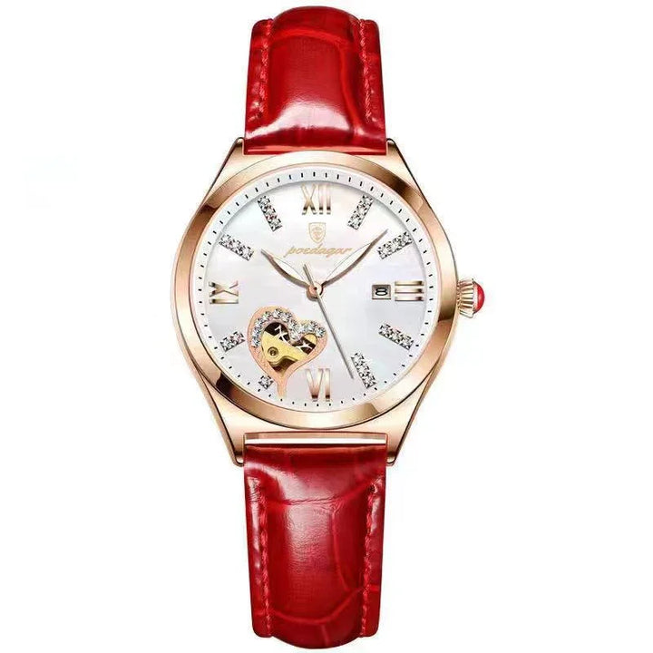 Elegant wristwatch with red leather strap, rose gold case, diamond hour markers, heart-shaped window on dial