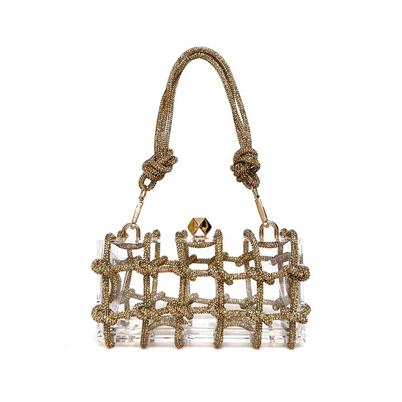 Transparent handbag with gold beaded grid overlay and knotted handles on white background