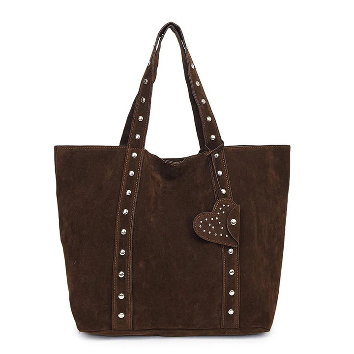 Brown suede tote bag with studded straps and heart-shaped studded charm