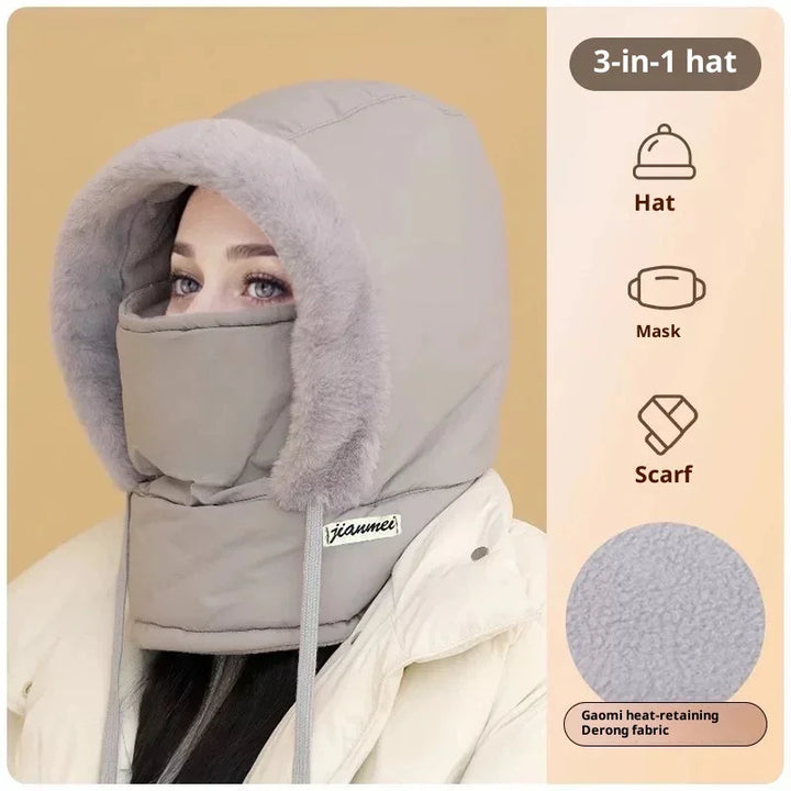 Woman wearing grey 3-in-1 winter hat with mask and scarf made of heat-retaining Derong fabric