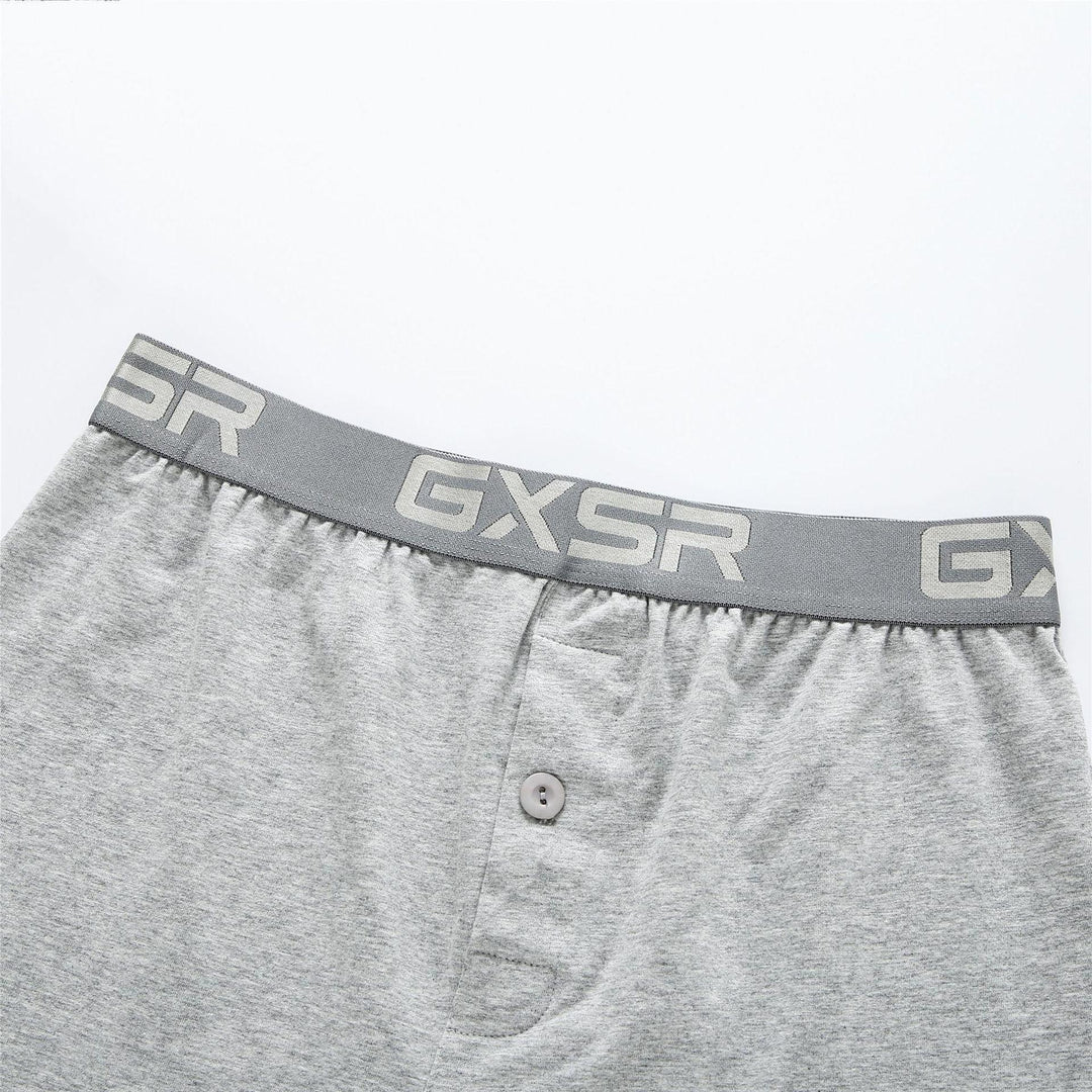 Close-up of gray men's boxer shorts with GXSR branded waistband and front button fly