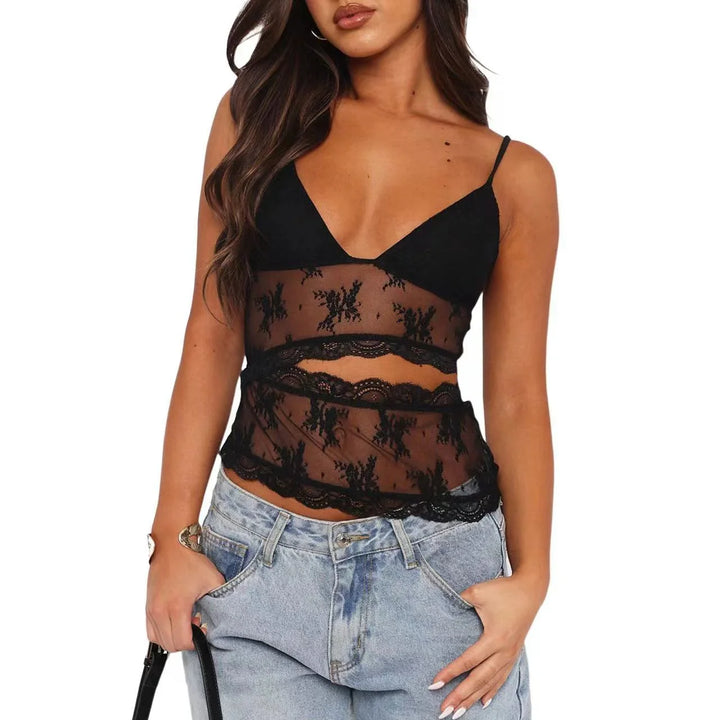 Woman wearing black lace mesh cami top with spaghetti straps and light blue jeans
