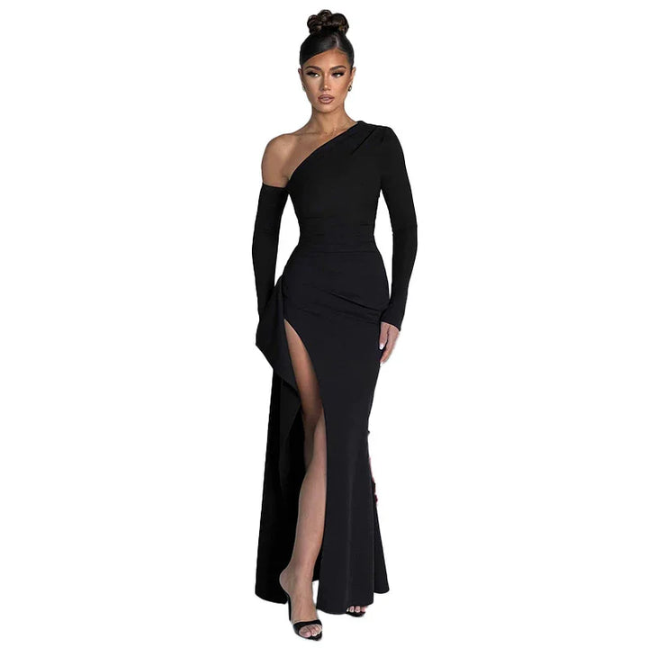 Elegant woman wearing a black one-shoulder evening gown with a high slit and long sleeve